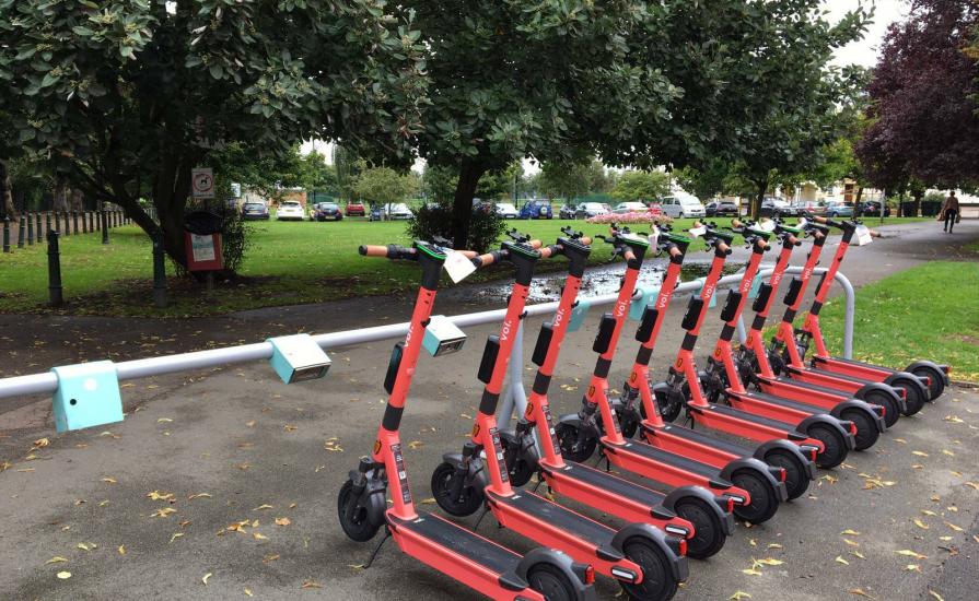 voi e scooters parked at racecourse